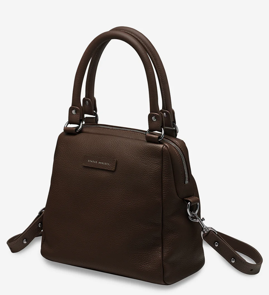 Last Mountains Bag - Cocoa - Status Anxiety 

The final assault to end it, to prevail over the proclivity to someone or something. The Last Mountains handbag with its taller silhouette is the perfect day to night companion and can be worn over elbow, shoulder or body (with long strap). Features a wide-opening main compartment, longer shoulder straps for added comfort and secret magnet-close pocket on the outside for your phone etc.

Soft shrunken pebble leather
Back magnet pocket
Internal zipper pocket