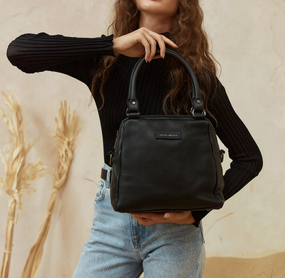 Last Mountains Bag - Black - Status Anxiety 

The final assault to end it, to prevail over the proclivity to someone or something. The Last Mountains handbag with its taller silhouette is the perfect day to night companion and can be worn over elbow, shoulder or body (with long strap). Features a wide-opening main compartment, longer shoulder straps for added comfort and secret magnet-close pocket on the outside for your phone etc.

Soft shrunken pebble leather
Back magnet pocket
Internal zipper pocket
