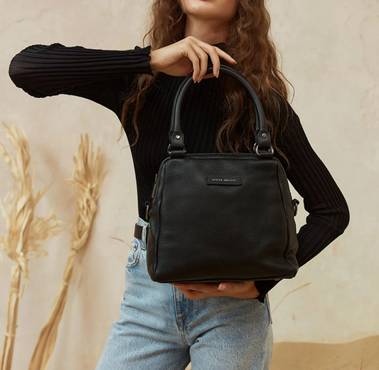 Last Mountains Bag - Black - Status Anxiety 

The final assault to end it, to prevail over the proclivity to someone or something. The Last Mountains handbag with its taller silhouette is the perfect day to night companion and can be worn over elbow, shoulder or body (with long strap). Features a wide-opening main compartment, longer shoulder straps for added comfort and secret magnet-close pocket on the outside for your phone etc.

Soft shrunken pebble leather
Back magnet pocket
Internal zipper pocket