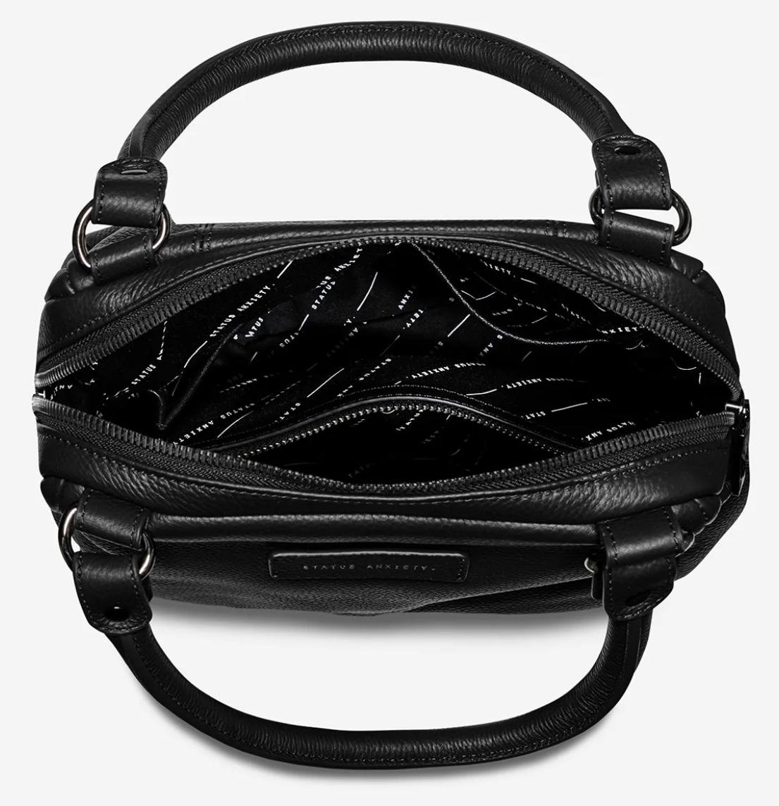 Last Mountains Bag - Black - Status Anxiety 

The final assault to end it, to prevail over the proclivity to someone or something. The Last Mountains handbag with its taller silhouette is the perfect day to night companion and can be worn over elbow, shoulder or body (with long strap). Features a wide-opening main compartment, longer shoulder straps for added comfort and secret magnet-close pocket on the outside for your phone etc.

Soft shrunken pebble leather
Back magnet pocket
Internal zipper pocket