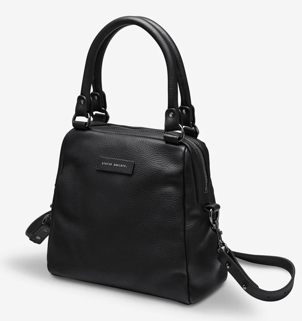 Last Mountains Bag - Black - Status Anxiety 

The final assault to end it, to prevail over the proclivity to someone or something. The Last Mountains handbag with its taller silhouette is the perfect day to night companion and can be worn over elbow, shoulder or body (with long strap). Features a wide-opening main compartment, longer shoulder straps for added comfort and secret magnet-close pocket on the outside for your phone etc.

Soft shrunken pebble leather
Back magnet pocket
Internal zipper pocket