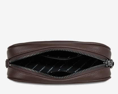 Plunder Bag With Dual Straps - Cocoa - Status Anxiety 

Our best selling bag of all time now comes with two different straps for twice the versatility. Clip on the leather strap for dressier occasions, or the webbed strap for a more casual vibe. It's a no brainer.

Soft shrunken pebble leather
Comes with Leather Strap Thin & Web Strap Medium
Back slider pocket
Internal zipper pocket, and open pouch pockets
Zipper close
Custom Status Anxiety lining
Comes in a Status Anxiety branded drawstring bag