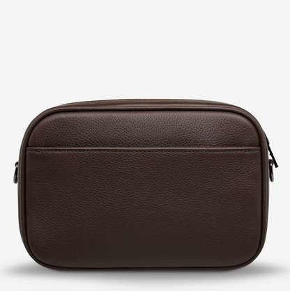 Plunder Bag With Dual Straps - Cocoa - Status Anxiety 

Our best selling bag of all time now comes with two different straps for twice the versatility. Clip on the leather strap for dressier occasions, or the webbed strap for a more casual vibe. It's a no brainer.

Soft shrunken pebble leather
Comes with Leather Strap Thin & Web Strap Medium
Back slider pocket
Internal zipper pocket, and open pouch pockets
Zipper close
Custom Status Anxiety lining
Comes in a Status Anxiety branded drawstring bag