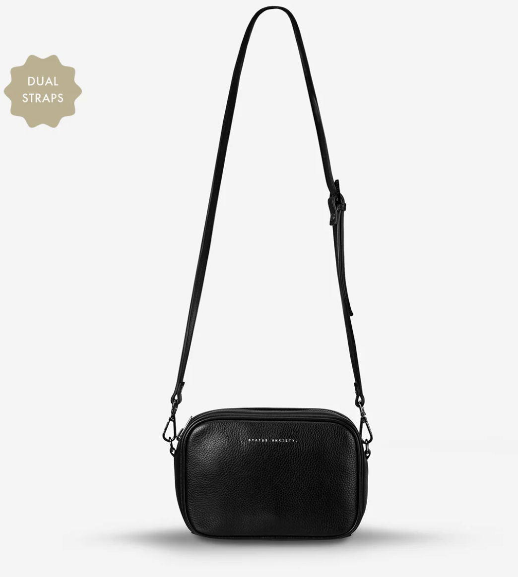 Plunder Bag Black With Duals Straps - Black - Status Anxiety 

Our best selling bag of all time now comes with two different straps for twice the versatility. Clip on the leather strap for dressier occasions, or the webbed strap for a more casual vibe. It's a no brainer.

Soft shrunken pebble leather
Comes with Leather Strap Thin & Web Strap Medium
Back slider pocket
Internal zipper pocket, and open pouch pockets
Zipper close
Custom Status Anxiety lining
Comes in a Status Anxiety branded drawstring bag