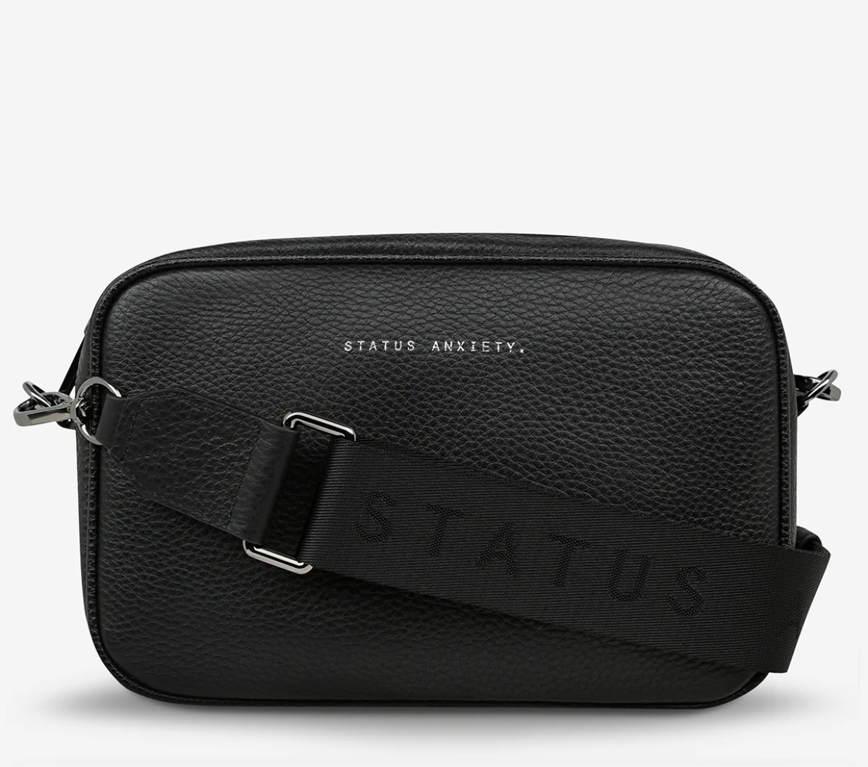 Plunder Bag Black With Duals Straps - Black - Status Anxiety 

Our best selling bag of all time now comes with two different straps for twice the versatility. Clip on the leather strap for dressier occasions, or the webbed strap for a more casual vibe. It's a no brainer.

Soft shrunken pebble leather
Comes with Leather Strap Thin & Web Strap Medium
Back slider pocket
Internal zipper pocket, and open pouch pockets
Zipper close
Custom Status Anxiety lining
Comes in a Status Anxiety branded drawstring bag