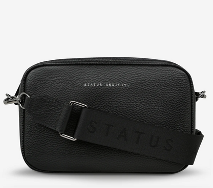 Plunder Bag Black With Duals Straps - Black - Status Anxiety 

Our best selling bag of all time now comes with two different straps for twice the versatility. Clip on the leather strap for dressier occasions, or the webbed strap for a more casual vibe. It's a no brainer.

Soft shrunken pebble leather
Comes with Leather Strap Thin & Web Strap Medium
Back slider pocket
Internal zipper pocket, and open pouch pockets
Zipper close
Custom Status Anxiety lining
Comes in a Status Anxiety branded drawstring bag