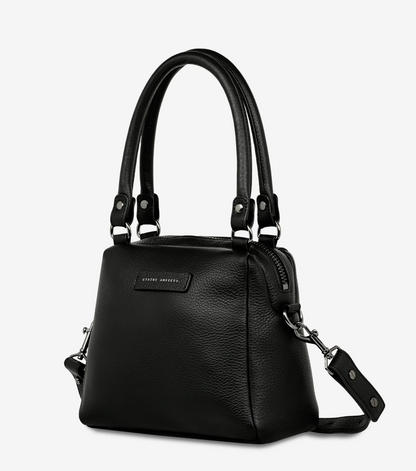 Mini Mountains Bag - Black - Status Anxiety 

Good things come in small packages. 'Mini Mountains' is a more compact version of the iconic 'Last Mountains' bag. This day to night companion can be worn on elbow, shoulder, or cross body (with included long strap). Features a wide-opening main compartment, longer shoulder strap for added comfort, and secret magnet-close pocket on the outside for your phone etc.

Soft shrunken pebble leather
Back magnet pocket
Internal zipper pocket, and open pockets