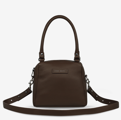 Mini Mountains Bag - Cocoa - Status Anxiety 
Good things come in small packages. 'Mini Mountains' is a more compact version of the iconic 'Last Mountains' bag. This day to night companion can be worn on elbow, shoulder, or cross body (with included long strap). Features a wide-opening main compartment, longer shoulder strap for added comfort, and secret magnet-close pocket on the outside for your phone etc.

Soft shrunken pebble leather
Back magnet pocket
Internal zipper pocket, and open pockets