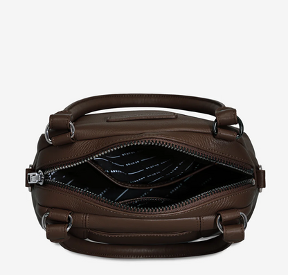 Mini Mountains Bag - Cocoa - Status Anxiety 
Good things come in small packages. 'Mini Mountains' is a more compact version of the iconic 'Last Mountains' bag. This day to night companion can be worn on elbow, shoulder, or cross body (with included long strap). Features a wide-opening main compartment, longer shoulder strap for added comfort, and secret magnet-close pocket on the outside for your phone etc.

Soft shrunken pebble leather
Back magnet pocket
Internal zipper pocket, and open pockets