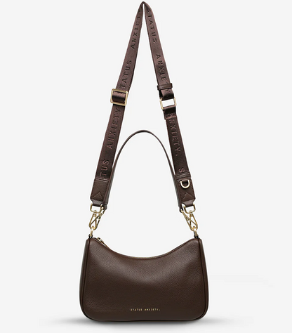 Look Both Ways Bag - Cocoa & Brushed Gold - Status Anxiety 

The 'Look Both Ways' bag will keep people guessing with her dual personality straps. Use the shorter shoulder strap for a dressier on-the-go look or go the longer web strap option to give off a more casual 'I don't have plans today' vibe.

Soft shrunken pebble leather
Brushed gold hardware
Internal zipper pocket, and card slots
Dual straps (short leather strap & thin webbed strap)
Custom Status Anxiety lining