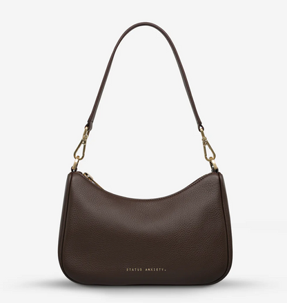 Look Both Ways Bag - Cocoa & Brushed Gold - Status Anxiety 

The 'Look Both Ways' bag will keep people guessing with her dual personality straps. Use the shorter shoulder strap for a dressier on-the-go look or go the longer web strap option to give off a more casual 'I don't have plans today' vibe.

Soft shrunken pebble leather
Brushed gold hardware
Internal zipper pocket, and card slots
Dual straps (short leather strap & thin webbed strap)
Custom Status Anxiety lining