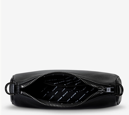 Look Both Ways Bag - Black - Status Anxiety 
The 'Look Both Ways' bag will keep people guessing with her dual personality straps. Use the shorter shoulder strap for a dressier on-the-go look or go the longer webbed strap option to give off a more casual 'I don't have plans today' vibe.

Soft shrunken pebble leather
Comes with leather shoulder strap and long webbed strap
Internal zipper pocket one side and 3 card slots on the other
Black custom Status Anxiety lining
20cm x 14cm x 7cm
Leather strap length 26c