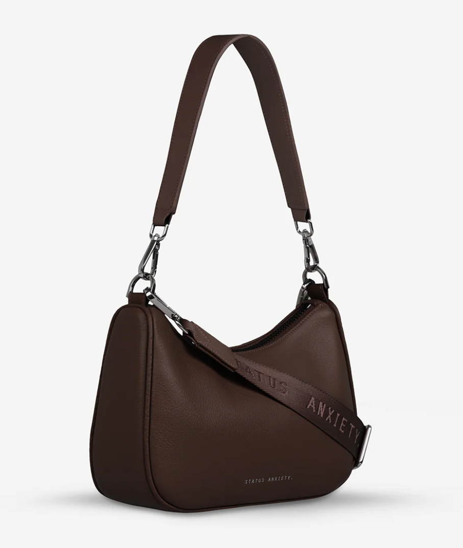 Look Both Ways Bag - Status Anxiety 

The 'Look Both Ways' bag will keep people guessing with her dual personality straps. Use the shorter shoulder strap for a dressier on-the-go look or go the longer web strap option to give off a more casual 'I don't have plans today' vibe.

Soft shrunken pebble leather
Internal zipper pocket, and card slots
Dual straps (short leather strap & thin webbed strap)
Custom Status Anxiety lining
Comes in a Status Anxiety branded drawstring bag