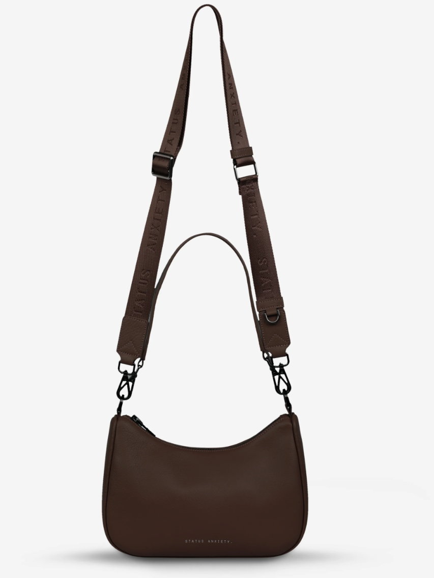 Look Both Ways Bag - Status Anxiety 

The 'Look Both Ways' bag will keep people guessing with her dual personality straps. Use the shorter shoulder strap for a dressier on-the-go look or go the longer web strap option to give off a more casual 'I don't have plans today' vibe.

Soft shrunken pebble leather
Internal zipper pocket, and card slots
Dual straps (short leather strap & thin webbed strap)
Custom Status Anxiety lining
Comes in a Status Anxiety branded drawstring bag