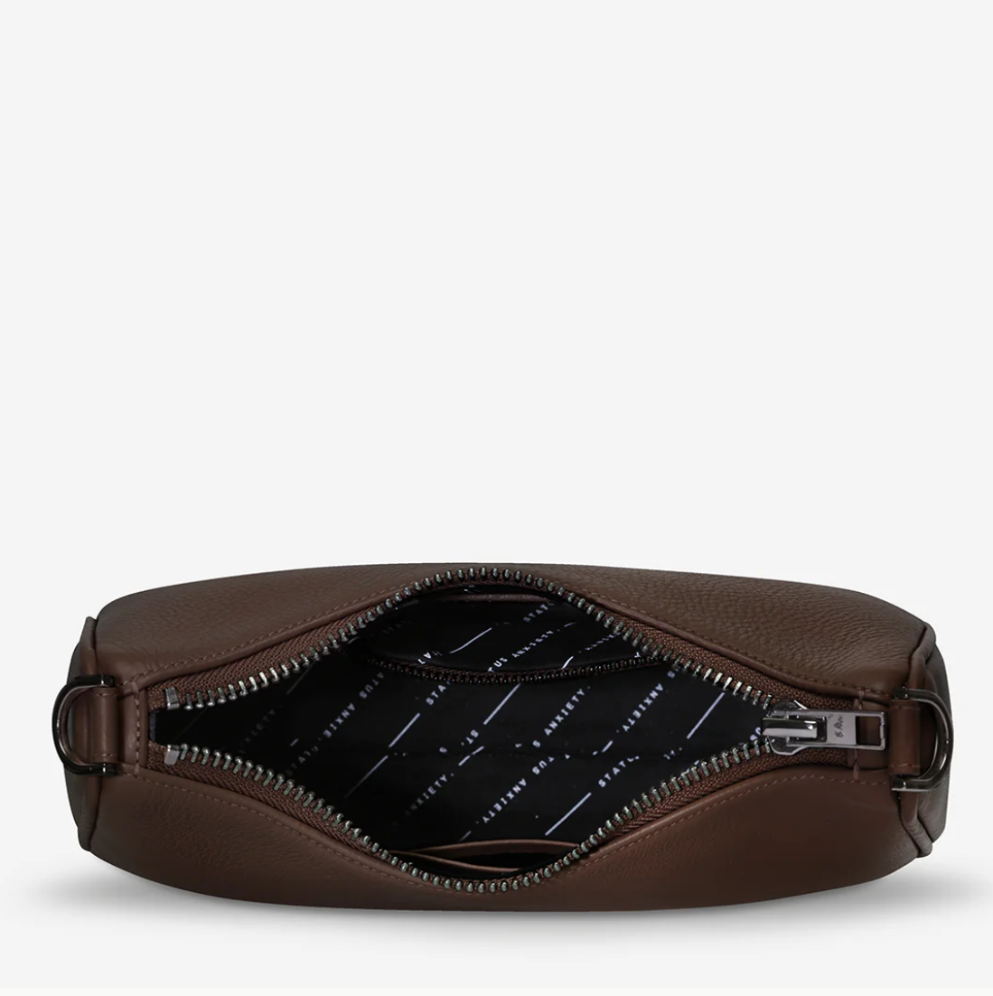 Look Both Ways Bag - Status Anxiety 

The 'Look Both Ways' bag will keep people guessing with her dual personality straps. Use the shorter shoulder strap for a dressier on-the-go look or go the longer web strap option to give off a more casual 'I don't have plans today' vibe.

Soft shrunken pebble leather
Internal zipper pocket, and card slots
Dual straps (short leather strap & thin webbed strap)
Custom Status Anxiety lining
Comes in a Status Anxiety branded drawstring bag