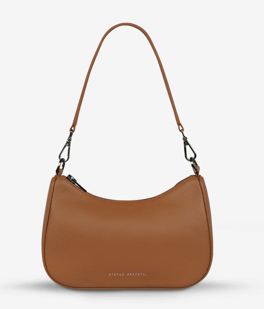 The 'Look Both Ways' bag will keep people guessing with her dual personality straps. Use the shorter shoulder strap for a dressier on-the-go look or go the longer web strap option to give off a more casual 'I don't have plans today' vibe.

Soft shrunken pebble leather
Internal zipper pocket, and card slots
Dual straps (short leather strap & thin webbed strap)
Custom Status Anxiety lining
Comes in a Status Anxiety branded drawstring bag