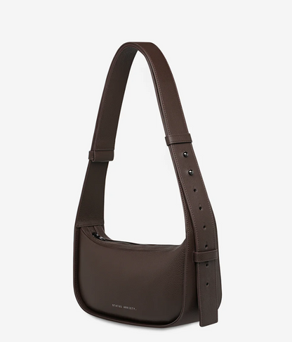 Haven Bag - Cocoa - Status Anxiety 

Versatile, elevated, and effortless. Wear 'Haven' over the shoulder or crossbody with her adjustable strap – whatever the day calls for.

Soft shrunken pebble leather
Internal zipper pocket, and two open pouch pockets
Zipper close
Custom Status Anxiety lining
Comes in a Status Anxiety branded drawstring bag