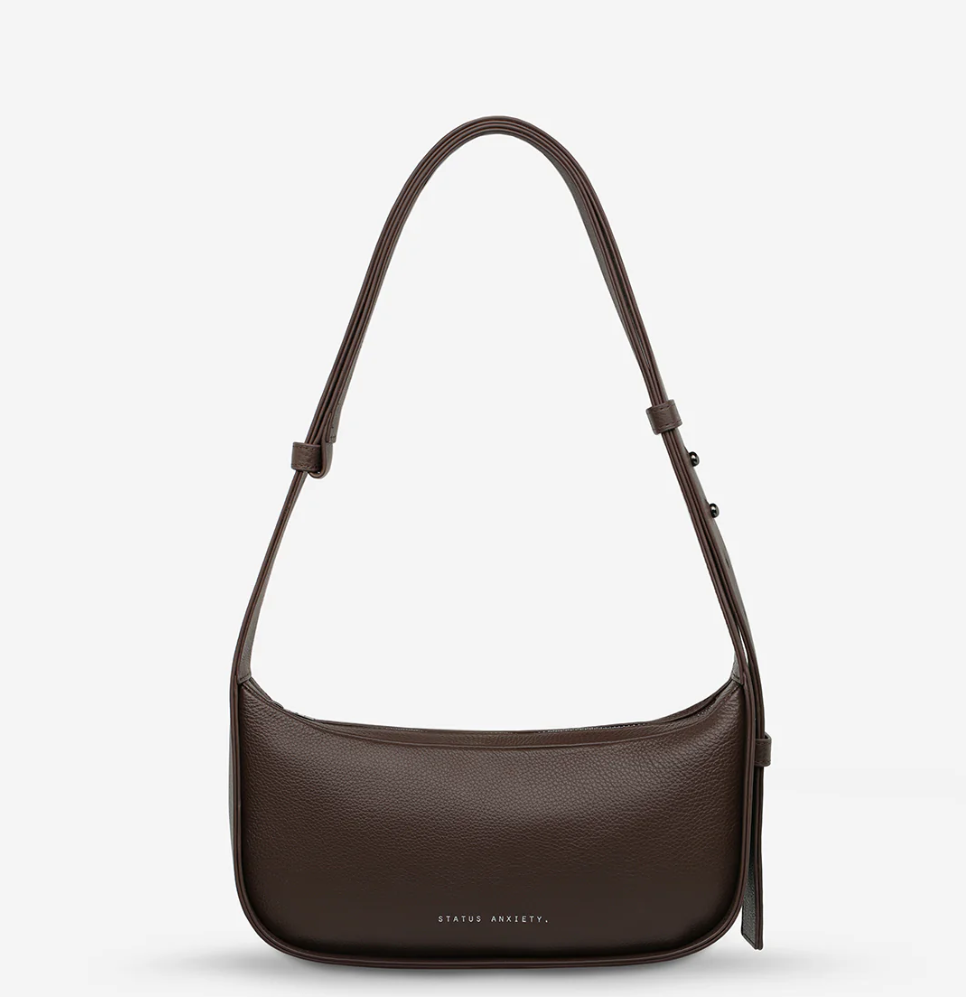 Haven Bag - Cocoa - Status Anxiety 

Versatile, elevated, and effortless. Wear 'Haven' over the shoulder or crossbody with her adjustable strap – whatever the day calls for.

Soft shrunken pebble leather
Internal zipper pocket, and two open pouch pockets
Zipper close
Custom Status Anxiety lining
Comes in a Status Anxiety branded drawstring bag