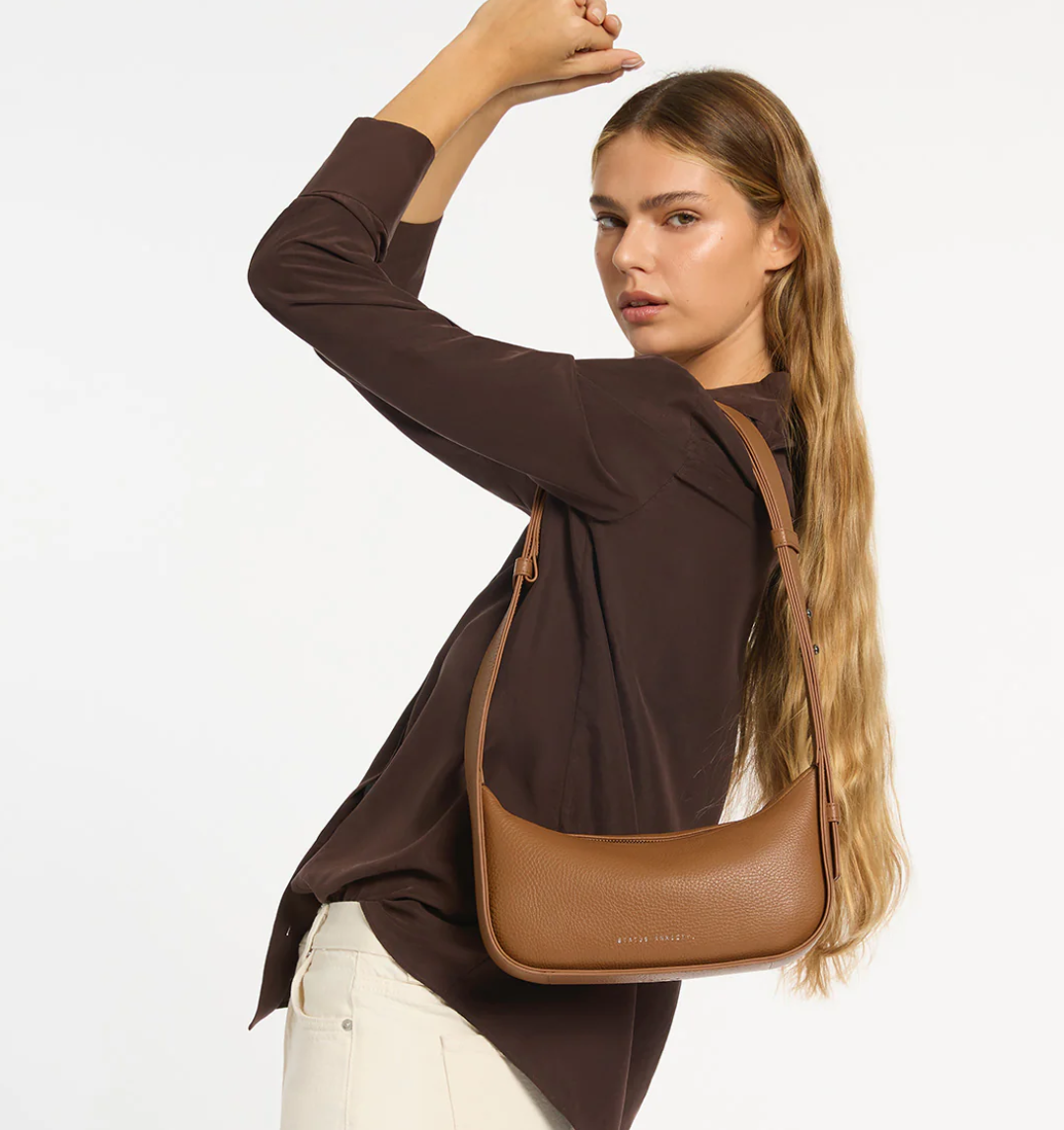 Haven Bag - Camel - Status Anxiety 

Versatile, elevated, and effortless. Wear 'Haven' over the shoulder or crossbody with her adjustable strap – whatever the day calls for.

Soft shrunken pebble leather
Internal zipper pocket, and two open pouch pockets
Zipper close
Custom Status Anxiety lining
Comes in a Status Anxiety branded drawstring bag