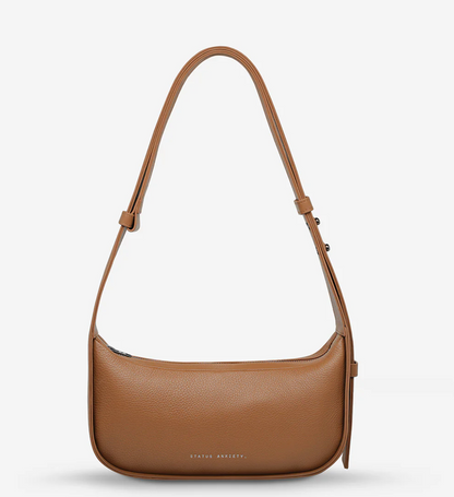 Haven Bag - Camel - Status Anxiety 

Versatile, elevated, and effortless. Wear 'Haven' over the shoulder or crossbody with her adjustable strap – whatever the day calls for.

Soft shrunken pebble leather
Internal zipper pocket, and two open pouch pockets
Zipper close
Custom Status Anxiety lining
Comes in a Status Anxiety branded drawstring bag