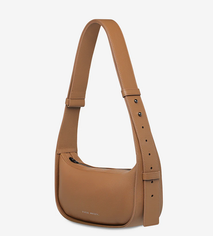 Haven Bag - Camel - Status Anxiety 

Versatile, elevated, and effortless. Wear 'Haven' over the shoulder or crossbody with her adjustable strap – whatever the day calls for.

Soft shrunken pebble leather
Internal zipper pocket, and two open pouch pockets
Zipper close
Custom Status Anxiety lining
Comes in a Status Anxiety branded drawstring bag