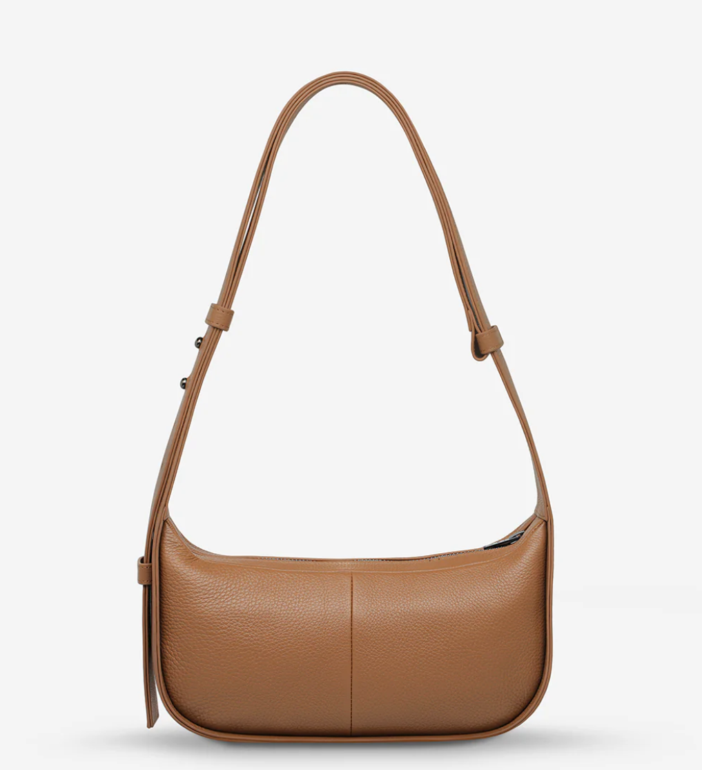 Haven Bag - Camel - Status Anxiety 

Versatile, elevated, and effortless. Wear 'Haven' over the shoulder or crossbody with her adjustable strap – whatever the day calls for.

Soft shrunken pebble leather
Internal zipper pocket, and two open pouch pockets
Zipper close
Custom Status Anxiety lining
Comes in a Status Anxiety branded drawstring bag