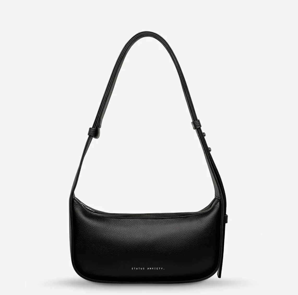 Haven Bag - Black - Status Anxiety 

Versatile, elevated, and effortless. Wear 'Haven' over the shoulder or crossbody with her adjustable strap – whatever the day calls for.

Soft shrunken pebble leather
Internal zipper pocket, and two open pouch pockets
Zipper close
Custom Status Anxiety lining
Comes in a Status Anxiety branded drawstring bag