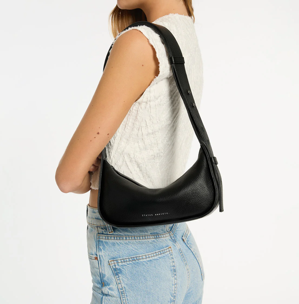 Haven Bag - Black - Status Anxiety 

Versatile, elevated, and effortless. Wear 'Haven' over the shoulder or crossbody with her adjustable strap – whatever the day calls for.

Soft shrunken pebble leather
Internal zipper pocket, and two open pouch pockets
Zipper close
Custom Status Anxiety lining
Comes in a Status Anxiety branded drawstring bag