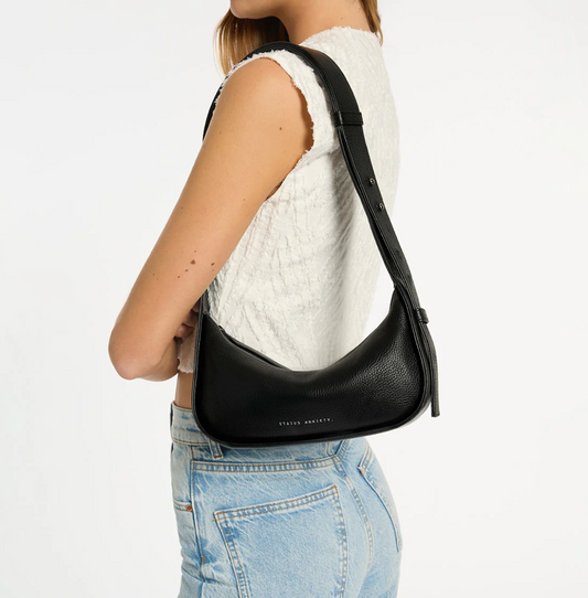 Haven Bag - Black - Status Anxiety 

Versatile, elevated, and effortless. Wear 'Haven' over the shoulder or crossbody with her adjustable strap – whatever the day calls for.

Soft shrunken pebble leather
Internal zipper pocket, and two open pouch pockets
Zipper close
Custom Status Anxiety lining
Comes in a Status Anxiety branded drawstring bag