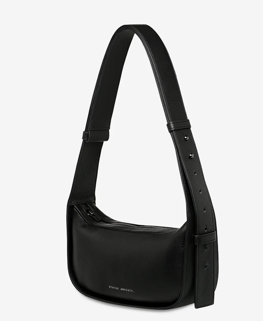 Haven Bag - Black - Status Anxiety 

Versatile, elevated, and effortless. Wear 'Haven' over the shoulder or crossbody with her adjustable strap – whatever the day calls for.

Soft shrunken pebble leather
Internal zipper pocket, and two open pouch pockets
Zipper close
Custom Status Anxiety lining
Comes in a Status Anxiety branded drawstring bag