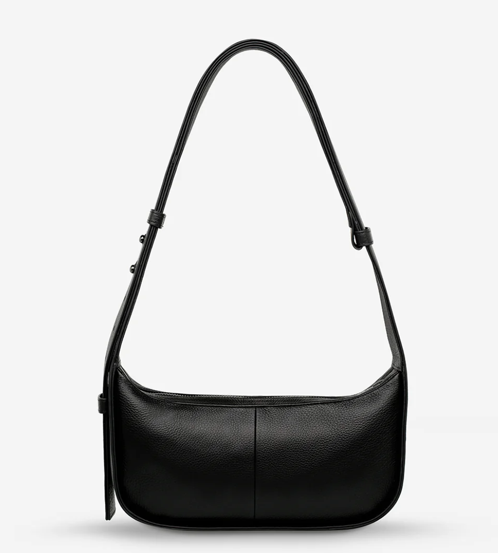 Haven Bag - Black - Status Anxiety 

Versatile, elevated, and effortless. Wear 'Haven' over the shoulder or crossbody with her adjustable strap – whatever the day calls for.

Soft shrunken pebble leather
Internal zipper pocket, and two open pouch pockets
Zipper close
Custom Status Anxiety lining
Comes in a Status Anxiety branded drawstring bag