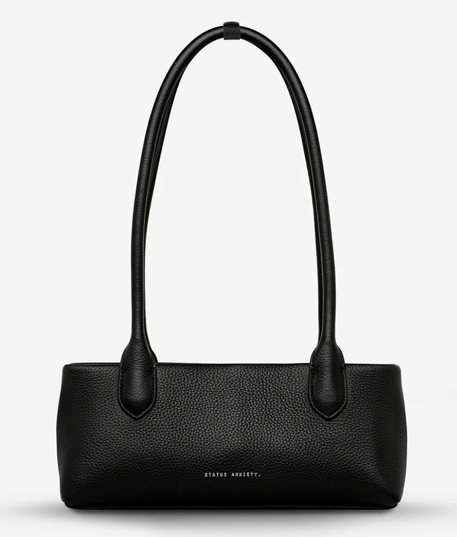 The Lost Bag - Black - Status Anxiety 

Not everything that’s lost needs finding. 'The Lost' carries itself with quiet confidence – structured yet soft, refined yet unpretentious. Featuring an easy magnetic closure, internal lipstick and zipper pockets, and enough space for what really matters.

Soft shrunken pebble leather
Internal zipper pocket, and lipstick pocket
Long structured shoulder straps
Magnet closure
Custom Status Anxiety lining
Comes in a Status Anxiety branded drawstring bag