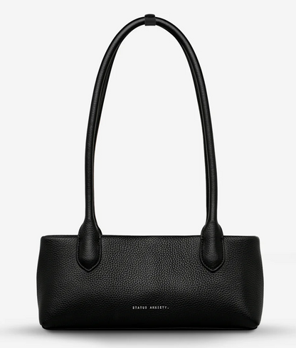 The Lost Bag - Black - Status Anxiety 

Not everything that’s lost needs finding. 'The Lost' carries itself with quiet confidence – structured yet soft, refined yet unpretentious. Featuring an easy magnetic closure, internal lipstick and zipper pockets, and enough space for what really matters.

Soft shrunken pebble leather
Internal zipper pocket, and lipstick pocket
Long structured shoulder straps
Magnet closure
Custom Status Anxiety lining
Comes in a Status Anxiety branded drawstring bag