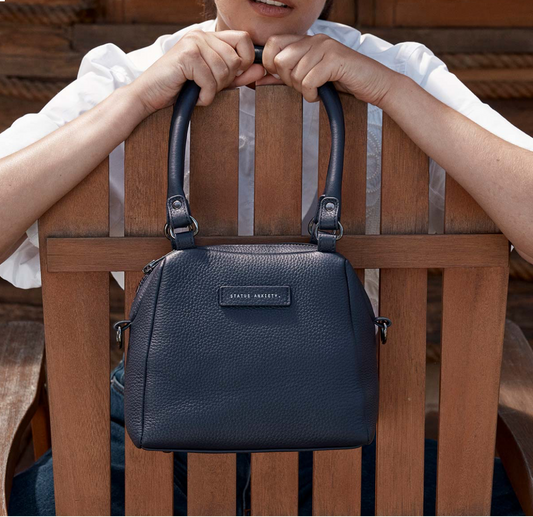Mini Mountains Bag - Midnight Blue - Status Anxiety 

Good things come in small packages. 'Mini Mountains' is a more compact version of the iconic 'Last Mountains' bag. This day to night companion can be worn on elbow, shoulder, or cross body (with included long strap). Features a wide-opening main compartment, longer shoulder strap for added comfort, and secret magnet-close pocket on the outside for your phone etc.

Soft shrunken pebble leather
Back magnet pocket
Internal zipper pocket, and open pockets