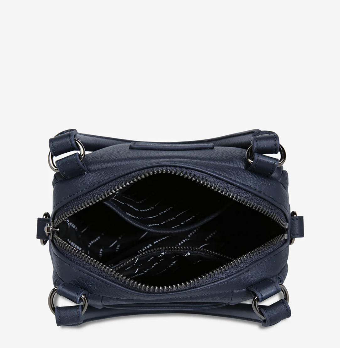 Mini Mountains Bag - Midnight Blue - Status Anxiety 

Good things come in small packages. 'Mini Mountains' is a more compact version of the iconic 'Last Mountains' bag. This day to night companion can be worn on elbow, shoulder, or cross body (with included long strap). Features a wide-opening main compartment, longer shoulder strap for added comfort, and secret magnet-close pocket on the outside for your phone etc.

Soft shrunken pebble leather
Back magnet pocket
Internal zipper pocket, and open pockets