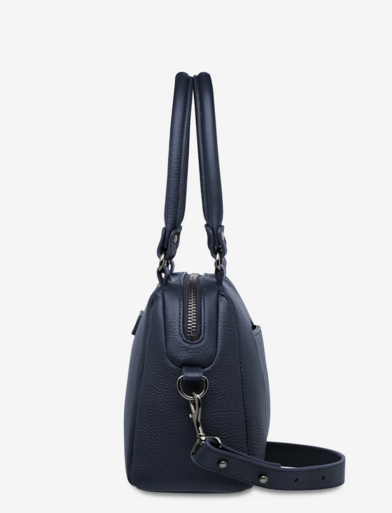 Mini Mountains Bag - Midnight Blue - Status Anxiety 

Good things come in small packages. 'Mini Mountains' is a more compact version of the iconic 'Last Mountains' bag. This day to night companion can be worn on elbow, shoulder, or cross body (with included long strap). Features a wide-opening main compartment, longer shoulder strap for added comfort, and secret magnet-close pocket on the outside for your phone etc.

Soft shrunken pebble leather
Back magnet pocket
Internal zipper pocket, and open pockets