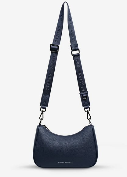 Look Both Ways Bag - Midnight Blue - Status Anxiety 

The 'Look Both Ways' bag will keep people guessing with her dual personality straps. Use the shorter shoulder strap for a dressier on-the-go look or go the longer web strap option to give off a more casual 'I don't have plans today' vibe.

Soft shrunken pebble leather
Internal zipper pocket, and card slots
Dual straps (short leather strap & thin webbed strap)
Custom Status Anxiety lining
Comes in a Status Anxiety branded drawstring bag