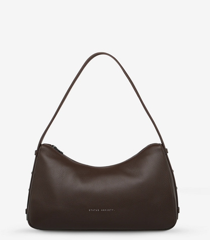 Hideout Bag - Cocoa - Status Anxiety 

Understated in design and quietly capable in size, 'Hideout' keeps things simple with its soft, slouchy shape and attitude.

Soft shrunken pebble leather
Internal zipper pocket, lipstick pocket, and open pouch pocket
Zipper closure
Custom Status Anxiety lining
Comes in a Status Anxiety branded drawstring bag