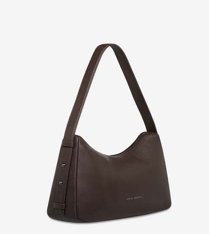 Hideout Bag - Cocoa - Status Anxiety 

Understated in design and quietly capable in size, 'Hideout' keeps things simple with its soft, slouchy shape and attitude.

Soft shrunken pebble leather
Internal zipper pocket, lipstick pocket, and open pouch pocket
Zipper closure
Custom Status Anxiety lining
Comes in a Status Anxiety branded drawstring bag