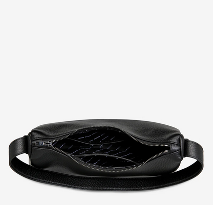Hideout Bag - Black - Status Anxiety 

Understated in design and quietly capable in size, 'Hideout' keeps things simple with its soft, slouchy shape and attitude.

Soft shrunken pebble leather
Internal zipper pocket, lipstick pocket, and open pouch pocket
Zipper closure
Custom Status Anxiety lining
Comes in a Status Anxiety branded drawstring bag