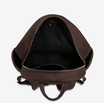 Frankie Recycled Bag - Truffle - Status Anxiety 

Tough, functional and lightweight – just what you've been looking for in a backpack (plus not to mention obvious good looks). Multiple exterior pockets keep everything within reach, while its lightweight build makes it ready for workdays, weekends, and everything between.

Premium reinforced recycled polyester (otherwise destined for landfill)
Back sleeve for sliding onto your suitcase
Dual external side pockets, and front zipper pocket
Internal open pockets