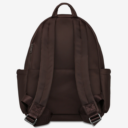 Frankie Recycled Bag - Truffle - Status Anxiety 

Tough, functional and lightweight – just what you've been looking for in a backpack (plus not to mention obvious good looks). Multiple exterior pockets keep everything within reach, while its lightweight build makes it ready for workdays, weekends, and everything between.

Premium reinforced recycled polyester (otherwise destined for landfill)
Back sleeve for sliding onto your suitcase
Dual external side pockets, and front zipper pocket
Internal open pockets