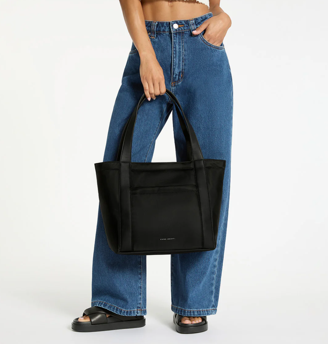 Mikah Recycled Bag - Black - Status Anxiety 

Frankie Recycled Bag - Truffle - Status Anxiety 

Tough, functional and lightweight – just what you've been looking for in a backpack (plus not to mention obvious good looks). Multiple exterior pockets keep everything within reach, while its lightweight build makes it ready for workdays, weekends, and everything between.

Premium reinforced recycled polyester (otherwise destined for landfill)
Back sleeve for sliding onto your suitcase
Dual external side pockets,