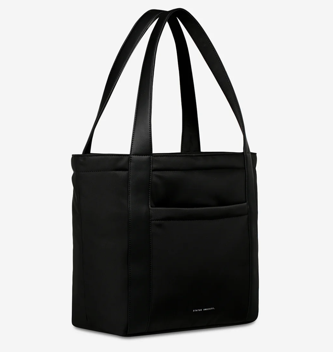 Mikah Recycled Bag - Black - Status Anxiety 

Frankie Recycled Bag - Truffle - Status Anxiety 

Tough, functional and lightweight – just what you've been looking for in a backpack (plus not to mention obvious good looks). Multiple exterior pockets keep everything within reach, while its lightweight build makes it ready for workdays, weekends, and everything between.

Premium reinforced recycled polyester (otherwise destined for landfill)
Back sleeve for sliding onto your suitcase
Dual external side pockets,