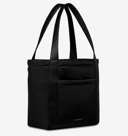 Mikah Recycled Bag - Black - Status Anxiety 

Frankie Recycled Bag - Truffle - Status Anxiety 

Tough, functional and lightweight – just what you've been looking for in a backpack (plus not to mention obvious good looks). Multiple exterior pockets keep everything within reach, while its lightweight build makes it ready for workdays, weekends, and everything between.

Premium reinforced recycled polyester (otherwise destined for landfill)
Back sleeve for sliding onto your suitcase
Dual external side pockets,