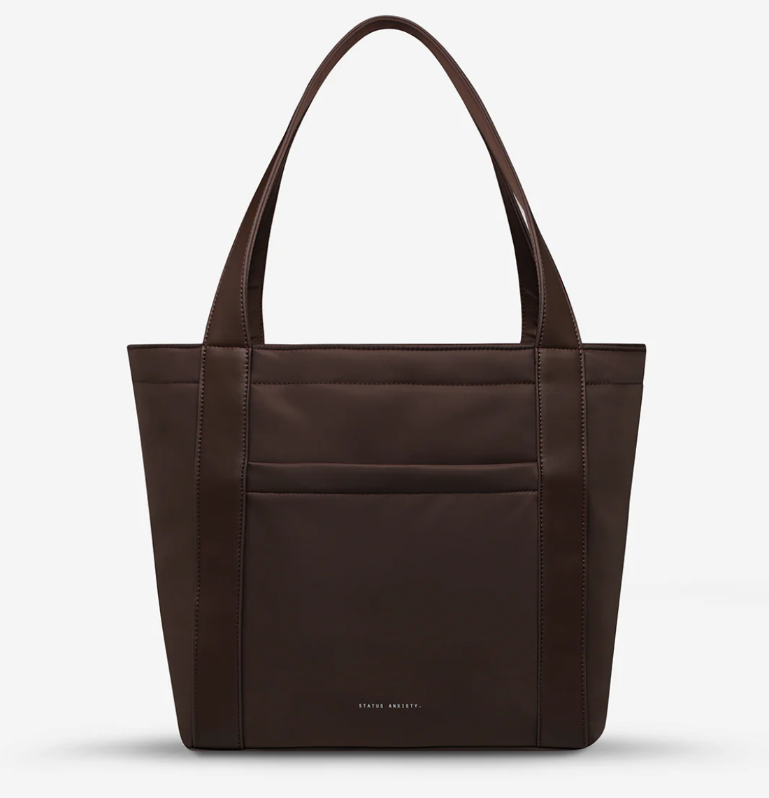 Mikah Recycled Bag - Truffle- Status Anxiety 
Structured, lightweight, and quietly capable. The 'Mikah' tote features external sleeve and zip pockets, a padded 13-inch laptop sleeve on the inside, and main compartment zip for when you want it all securely locked down. Crafted from premium reinforced recycled polyester, 'Mikah' carries light but works hard.

Premium reinforced recycled polyester (otherwise destined for landfill)
Back sleeve for sliding onto your suitcase
Front zipper pocket