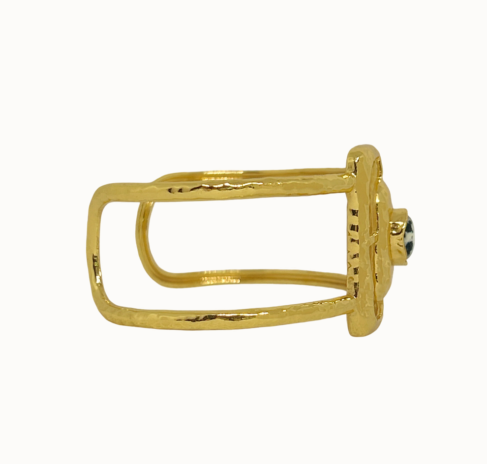 Astrid Gold Cuff - Mountain & Moon 

Description

Astrid commands attention without asking for it. A wide hammered gold cuff with an open rectangular frame at its centre, set with a Dalmatian Jasper stone - architectural, organic, and unmistakably considered.

A statement piece from the Odyssey collection - for the woman who adorns herself with meaning, not just habit.

Micron 18K gold & sterling silver plating 
to premium jewellery standards
