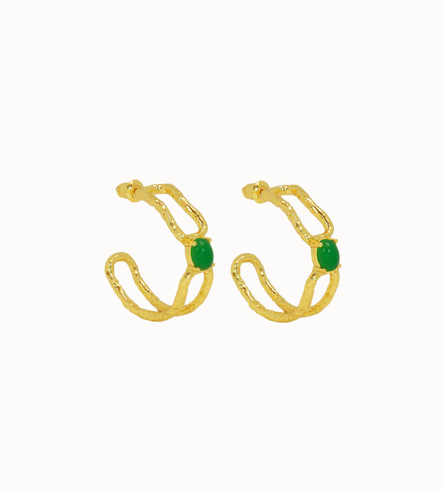Sascha Earrings Gold - Mountain & Moon 

Description

ELEVATED ESSENTIALS • WEAR ON REPEAT

The Sascha Earrings bring sculptural sophistication to your everyday rotation. 
An organic, open double-hoop silhouette, anchored by a vibrant Green Jade gemstone at its center - an unexpected focal point that feels both grounded and playful. Softly textured gold catches the light, adding dimension and a subtle vintage inspired edge. 