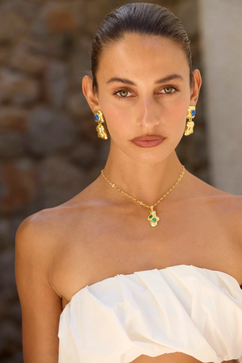 EFFORTLESS STATEMENT • EVERYDAY GO-TO

Meet Dominique - sculptural, refined and endlessly wearable.

Designed as part of the Dominique Elissa x Mountain & Moon collaboration, Features softly hammered gold paired with a vivid blue chalcedony gemstone. Organic lines, subtle texture and just enough colour to lift your look without trying too hard.

Smaller in length and lighter in feel, she’s the kind of earring that works with everything - and quietly becomes your go-to 