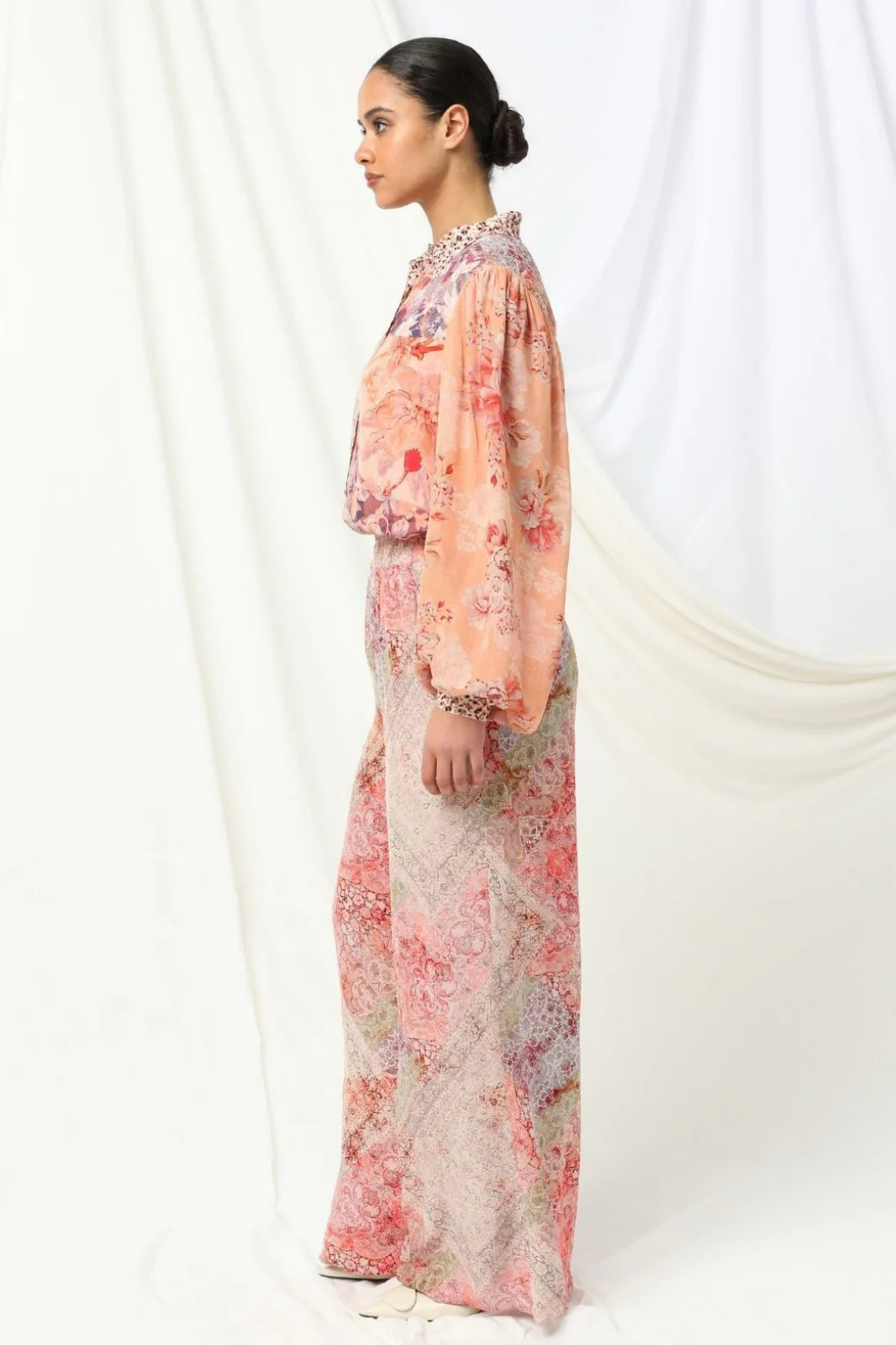 the kachel selena pant in pink is a stylish wide-leg pant in a viscose fabric in a beaituful patchwork print in warm feminine tones